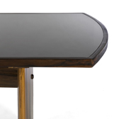 Dining table in Jacaranda and black glass. .